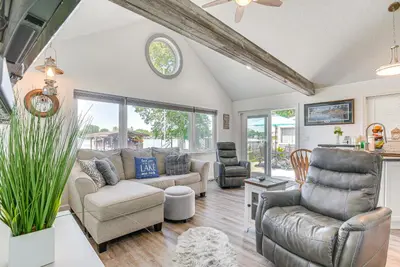 a living room with a couch and chairs at Waterfront with Boat Dock Retreat on Indian Lake in Lakeview