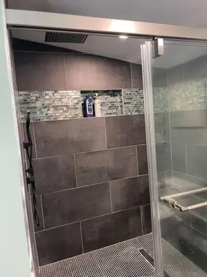 a shower with a glass door in a bathroom at Serenity away from the big city in Amelia