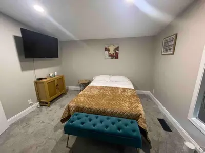 a bedroom with a bed and a tv in it at Serenity away from the big city in Amelia
