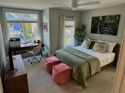 a bedroom with a bed and a desk and a computer at Mt Adams Adventure in Cincinnati