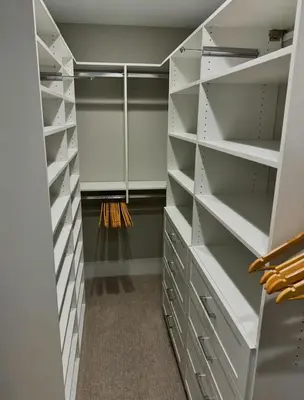 a walk in closet with white shelves at Mt Adams Adventure in Cincinnati