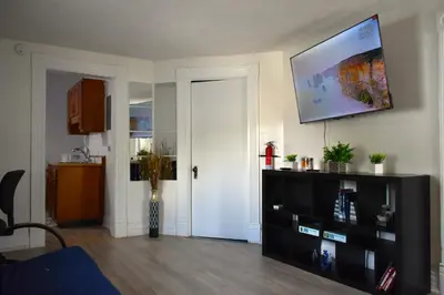 a living room with a flat screen tv on the wall at Spacious 2bdrm in Lima's Heart in Lima