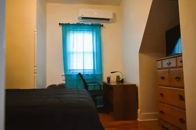 a bedroom with a bed and a dresser and a window at Spacious 2bdrm in Lima's Heart in Lima