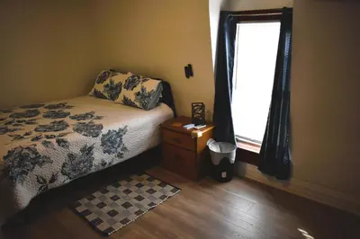 a small bedroom with a bed and a window at Spacious 2bdrm in Lima's Heart in Lima