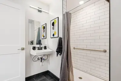 a bathroom with a sink and a shower at Columbus Gem with Pool Table! Pets Welcome! in Columbus