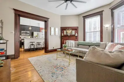 a living room with a couch and a table at 4 Bed Townhome near Goodale Park in Columbus