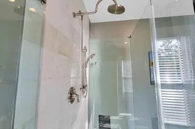 a bathroom with a shower with a glass door at 4 Bed Townhome near Goodale Park in Columbus
