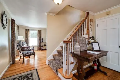 a home office with a staircase and a desk at Antique Charm 3BR Gourmet Kitchen & Large Yard in Kettering
