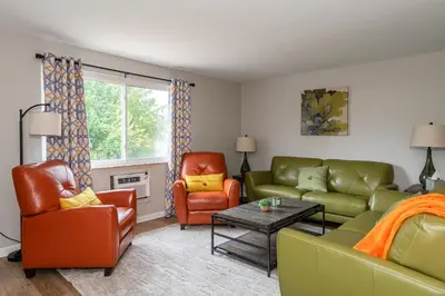 a living room with a couch and two chairs at Modern 2BR Gem Steps to The Greene UD & WPAFB in Kettering