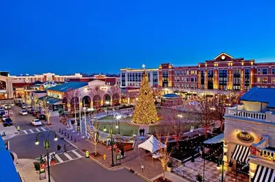 a christmas tree in the middle of a city street at Heart Day Deal Holiday Retreat Prime Location in Kettering