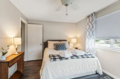 a bedroom with a bed and a window at Modern Gem Steps from The Greene UD & WPAFB in Kettering