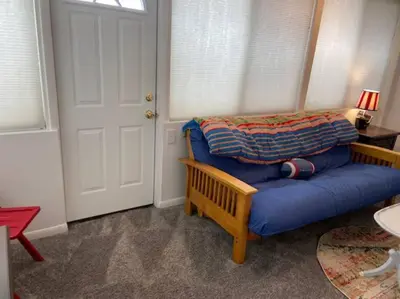 a bedroom with a blue bed in a room at Adorable Buckeye Lake Cottage in Buckeye Lake