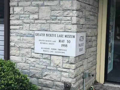 a sign on the side of a brick building at Adorable Buckeye Lake Cottage in Buckeye Lake