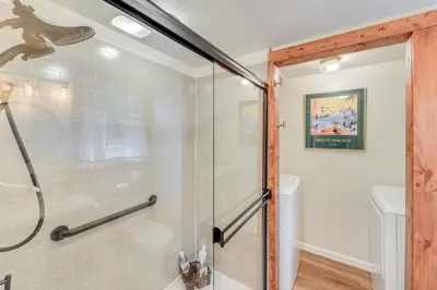 a bathroom with a shower with a glass door at Peaceful Hiram Retreat on Cuyahoga River! in Aurora