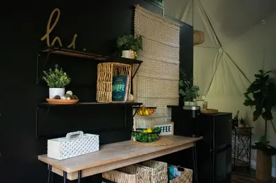 a wooden shelf with baskets and plants on it at Mohican Hideaway in Brinkhaven