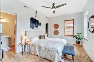 a bedroom with a bed and a ceiling fan at Vaughn Lofts # 4 in Cincinnati