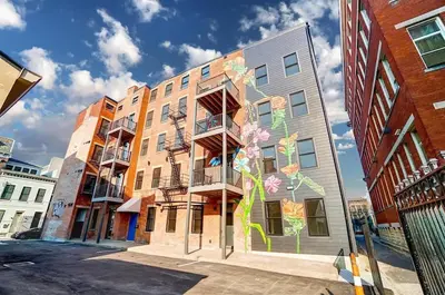 a building with flowers painted on the side of it at Vaughn Lofts # 4 in Cincinnati