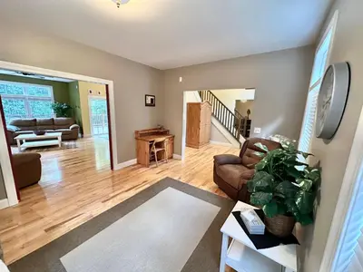 a living room with a couch and a table at Redbud Retreat in Centerville