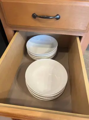two plates and bowls in a wooden cabinet at Kentucky - It's Natural! in Georgetown