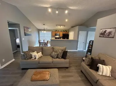 a living room with a couch and a kitchen at Kentucky - It's Natural! in Georgetown