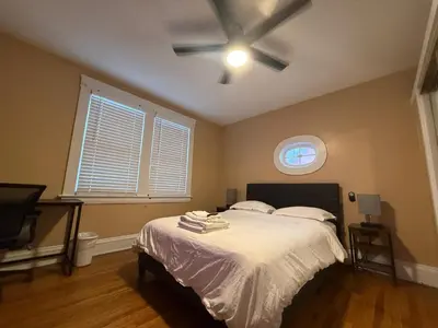 a bedroom with a bed and a ceiling fan at Stay with Jay - Segunda Room in Cleveland