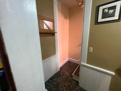 a hallway with a room with pink walls at Stay with Jay - Segunda Room in Cleveland