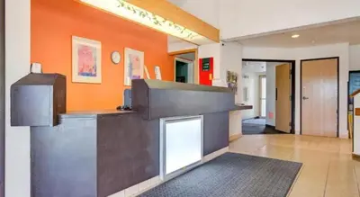 a lobby with a counter in a building at Hotel Markle IN I-69 in Markle
