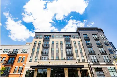 a building with a sign on the front of it at 2 Stylish apartments near shops and entertainment in Cincinnati