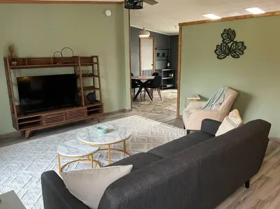 a living room with a couch and a tv at Auburn in Chester
