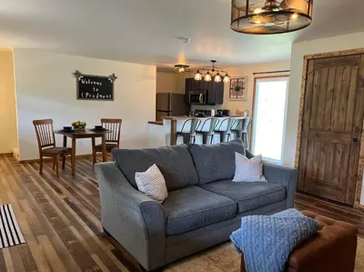 a living room with a couch and a kitchen at Piedmont in Chester