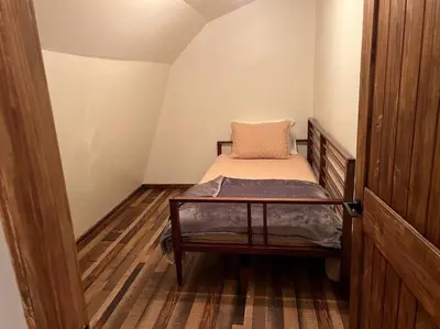 a small room with a bed with a pillow on it at Piedmont in Chester