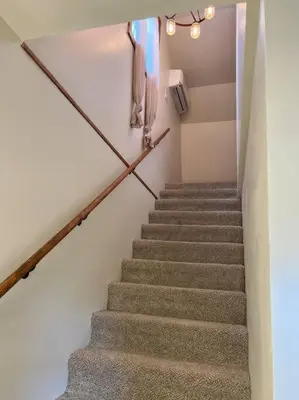 a stairway with a flight of stairs in a house at Piedmont in Chester