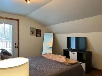 a bedroom with a bed and a flat screen tv at Piedmont in Chester