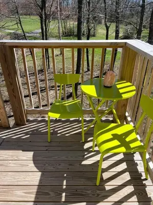 two chairs and a table on a wooden deck at Piedmont in Chester