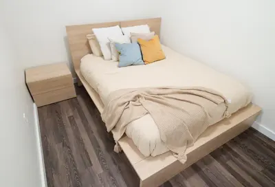 a bed with pillows on it in a room at The Standard Downtown Columbus in Columbus