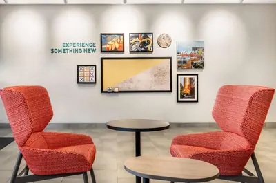 a waiting room with two chairs and a table at Home2 Suites By Hilton Reynoldsburg Columbus East in Columbus