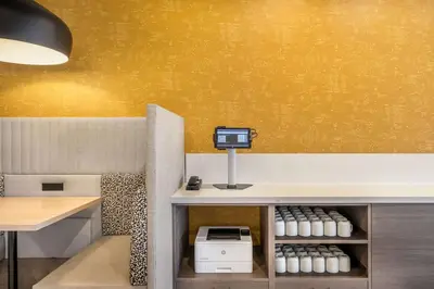 a room with a counter with a monitor on a wall at Home2 Suites By Hilton Reynoldsburg Columbus East in Columbus
