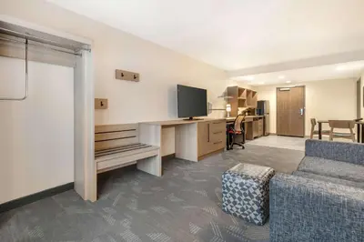 a living room with a couch and a tv in a room at Home2 Suites By Hilton Reynoldsburg Columbus East in Columbus
