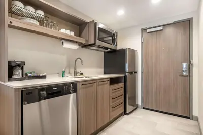a kitchen with a sink and a refrigerator at Home2 Suites By Hilton Reynoldsburg Columbus East in Columbus
