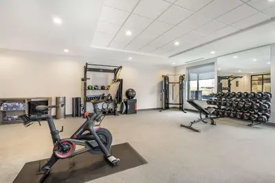 a gym with treadmills and exercise equipment in a building at Home2 Suites By Hilton Reynoldsburg Columbus East in Columbus