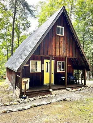 a small wooden cabin in the middle of the woods at HOT TUB -Secluded Cabin Cave Run Lake and near Red River Gorge in Wellington
