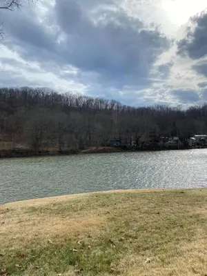 a large body of water with trees in the background at Take me to the River! in Zanesville