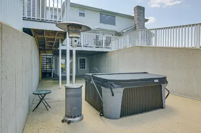 a trash can and a street light in front of a house at Sprawling Kentucky Getaway with Pool and Hot Tub! in Berry