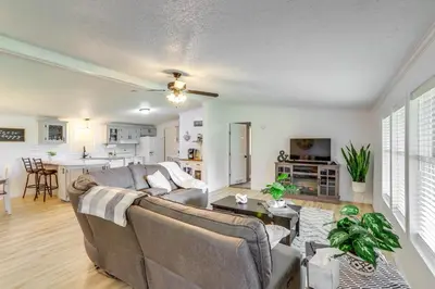 a living room with a couch and a table at North Fairfield Family Home with Hot Tub and Porch! in Willard