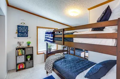 a bedroom with two bunk beds in a house at North Fairfield Family Home with Hot Tub and Porch! in Willard