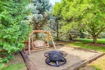 a playground with a grill and a swing at North Fairfield Family Home with Hot Tub and Porch! in Willard