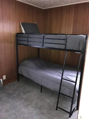 a bunk bed with a laptop on top of it at 3BR 1BA North End Walk to the Hospital in Zanesville
