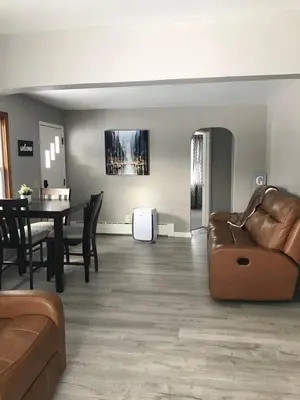 a living room with a couch and a table at 3BR 1BA North End Walk to the Hospital in Zanesville