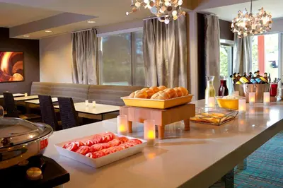 a table with bread and other food on it at Residence Inn by Marriott Columbus Dublin in Dublin