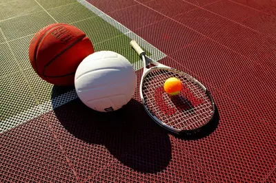 a tennis racket and a ball on a tennis court at Residence Inn by Marriott Columbus Dublin in Dublin